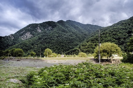 Beautiful summer landscape in mountains, green meadows and the dark blue sky with clouds . Big Caucasus. Azerbaijan Sheki Gakh Oguzの写真素材