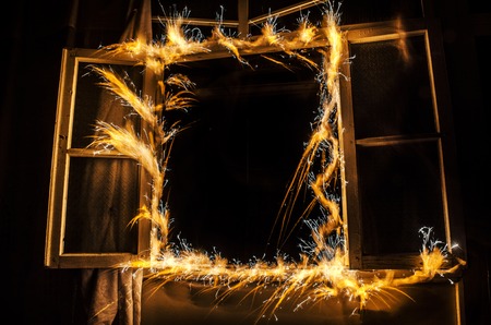Abstract fireworks flame freezelight on window. Apartment building on Fire at Night time. Fire conceptの写真素材