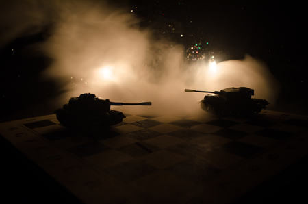 Three tanks in the conflict zone. The war in the countryside. Tank silhouette at night. Battle scene. War conceptの写真素材