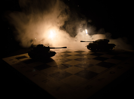 Three tanks in the conflict zone. The war in the countryside. Tank silhouette at night. Battle scene. War conceptの写真素材
