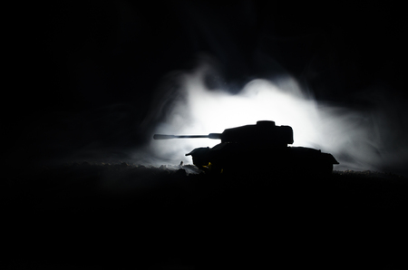 Three tanks in the conflict zone. The war in the countryside. Tank silhouette at night. Battle scene. War conceptの写真素材