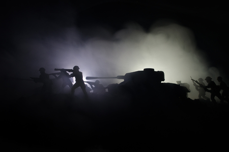 Three tanks in the conflict zone. The war in the countryside. Tank silhouette at night. Battle scene. War conceptの写真素材