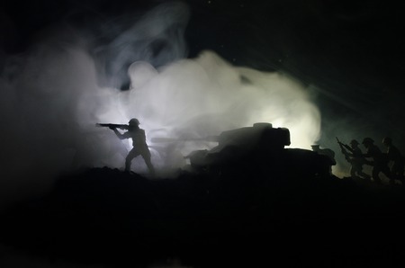 Three tanks in the conflict zone. The war in the countryside. Tank silhouette at night. Battle scene. War conceptの写真素材