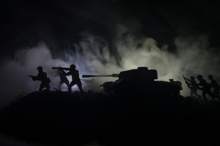 Three tanks in the conflict zone. The war in the countryside. Tank silhouette at night. Battle scene. War conceptの写真素材