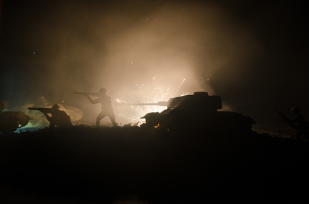 Three tanks in the conflict zone. The war in the countryside. Tank silhouette at night. Battle scene. War conceptの写真素材