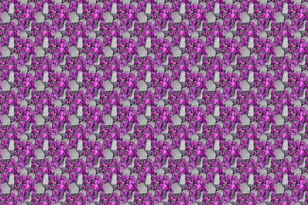 Seamless texture of gravel, Stone wall background multi colored with red green yellow blue violet purple, useful as wallpaper or website or game designの写真素材