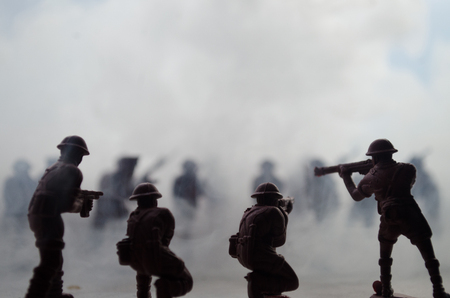 War Concept. Military silhouettes fighting scene on war fog sky background, World War Soldiers Silhouettes Below Cloudy Skyline At night. Attack scene. Armored vehicles. Tanks battleの写真素材