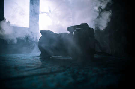 Black digital camera on dark background. Selective focusの写真素材