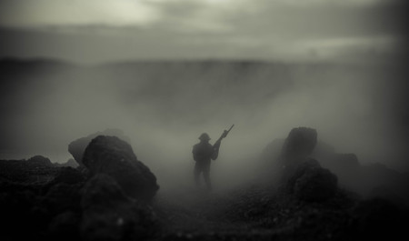 War Concept. Military silhouettes fighting scene on war fog sky background, World War Soldiers Silhouettes Below Cloudy Skyline At night. Attack scene. Armored vehicles. Tanks battle. Decorationの写真素材
