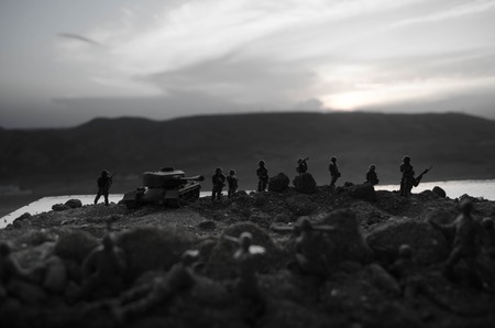 War Concept. Military silhouettes fighting scene on war fog sky background, World War Soldiers...