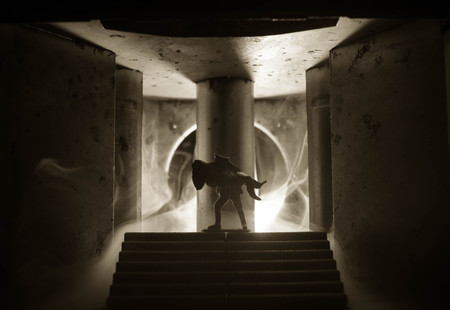 a silhouette of a man holding on to the woman. Rescue saviour concept. Escape from fire or danger. Surreal decorationの写真素材