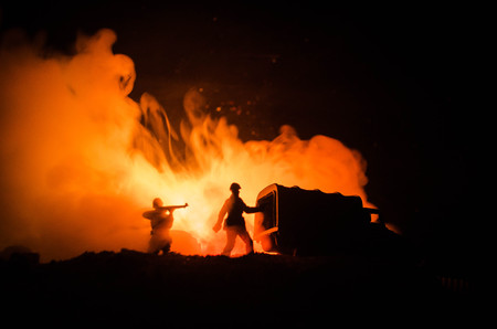 War Concept. Military silhouettes fighting scene on war fog sky background, World War Soldiers Silhouettes Below Cloudy Skyline At night. Attack scene. Armored vehicles. Tanks battle. Decorationの写真素材