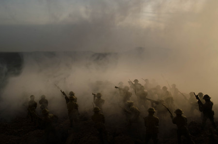 War Concept. Military silhouettes fighting scene on war fog sky background, World War Soldiers Silhouettes Below Cloudy Skyline At night. Attack scene. Armored vehicles. Tanks battle. Decorationの写真素材