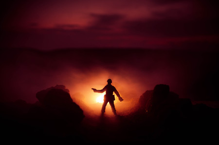 War Concept. Military silhouettes fighting scene on war fog sky background, World War Soldiers Silhouettes Below Cloudy Skyline At night. Attack scene. Armored vehicles. Tanks battle. Decorationの写真素材