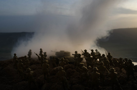 War Concept. Military silhouettes fighting scene on war fog sky background, World War Soldiers Silhouettes Below Cloudy Skyline At night. Attack scene. Armored vehicles. Tanks battle. Decorationの写真素材