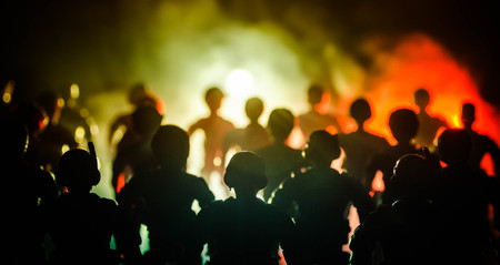 Anti-riot police give signal to be ready. Government power concept. Police in action. Smoke on a dark background with lights. Blue red flashing sirens. Dictatorship powerの写真素材