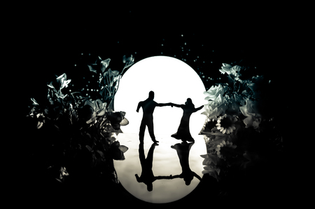 Old house with a Ghost in the moonlit night or Abandoned Haunted Horror House in fog. Old mystic villa with surreal big full moon. Horror Halloween concept.の写真素材