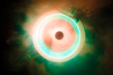 Concept of speed - Trail of fire and smoke - Vinyl record. Burning vinyl disk. Turntable vinyl record player. Retro audio equipment for disc jockey. Sound technologyの写真素材