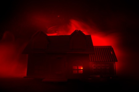 Old house with a Ghost in the moonlit night or Abandoned Haunted Horror House in fog. Old mystic villa with surreal big full moon. Horror Halloween concept.の写真素材
