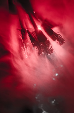 Network switch and ethernet cables, symbol of global communications. Colored network cables on dark background with lights and smoke. Selective focus. Network internet concept backgroundの写真素材