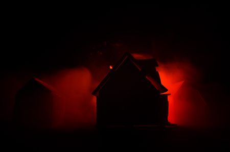 Old house with a Ghost in the moonlit night or Abandoned Haunted Horror House in fog. Old mystic villa with surreal big full moon. Horror Halloween concept.の写真素材