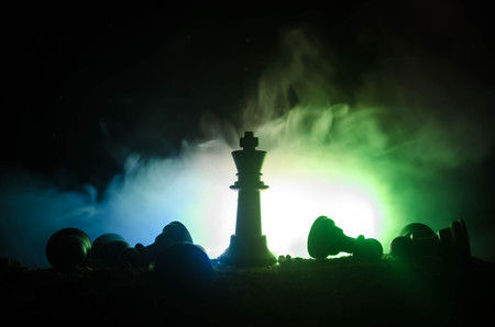 chess board game concept of business ideas and competition and strategy ideas concep. Chess figures on a dark background with smoke and fog. Selective focusの写真素材