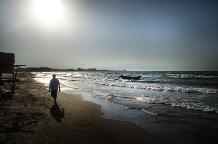 Beautiful landscape of Boat on the beach in cloudy weather. Vintage Boat in the seashore. Azerbaijan Caspian Seaの写真素材