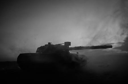 War Concept. Military silhouettes fighting scene on war fog sky background, World War German Tanks Silhouettes Below Cloudy Skyline At night. Attack scene. Armored vehicles. Tanks battleの写真素材