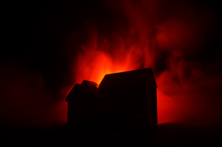 Old house with a Ghost in the moonlit night or Abandoned Haunted Horror House in fog. Old mystic villa with surreal big full moon. Horror Halloween concept.の写真素材
