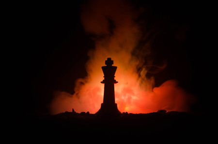 chess board game concept of business ideas and competition and strategy ideas concep. Chess figures on a dark background with smoke and fog. Selective focusの写真素材