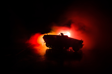 War Concept. Military silhouettes fighting scene on war fog sky background, World War German Tanks Silhouettes Below Cloudy Skyline At night. Attack scene. Armored vehicles. Tanks battleの写真素材