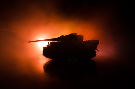 War Concept. Military silhouettes fighting scene on war fog sky background, World War German Tanks Silhouettes Below Cloudy Skyline At night. Attack scene. Armored vehicles. Tanks battleの写真素材