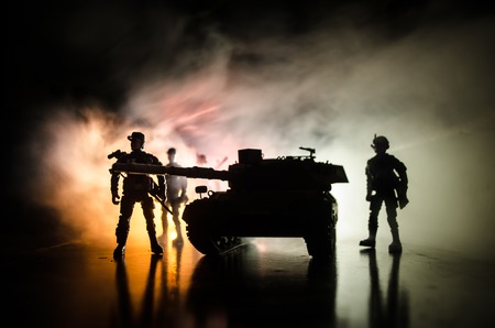 War Concept. Military silhouettes fighting scene on war fog sky background, World War German Tanks Silhouettes Below Cloudy Skyline At night. Attack scene. Armored vehicles. Tanks battleの写真素材