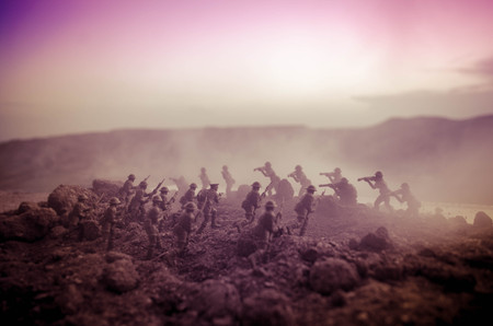 War Concept. Military silhouettes fighting scene on war fog sky background, World War Soldiers Silhouettes Below Cloudy Skyline At night. Attack scene. Armored vehicles. Tanks battle. Decorationの写真素材