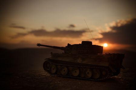 War Concept. Military silhouettes fighting scene on war fog sky background, World War German Tanks Silhouettes Below Cloudy Skyline At night. Attack scene. Armored vehicles. Tanks battleの写真素材