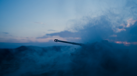 War Concept. Military silhouettes fighting scene on war fog sky background, World War German Tanks...