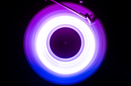 Concept of speed - Trail of fire and smoke - Vinyl record. Burning vinyl disk. Turntable vinyl record player. Retro audio equipment for disc jockey. Sound technologyの写真素材
