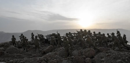 War Concept. Military silhouettes fighting scene on war fog sky background, World War Soldiers Silhouettes Below Cloudy Skyline At night. Attack scene. Armored vehicles. Tanks battle. Decorationの写真素材