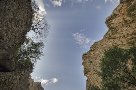 amazing landscape of rocky mountains and blue sky . Sky view between two rocks. Big Caucasus...
