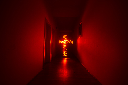 Dark corridor with cabinet doors and freezelight figures on it. Horror Concept.の写真素材