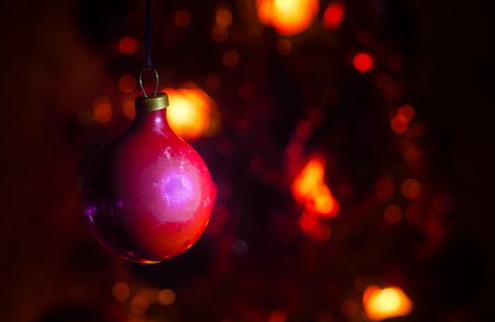 Christmas Toy on the Christmas tree. New Year ornaments winter background for postcard empty space. New Year eve background - glass Christmas toy. Greeting cardの写真素材