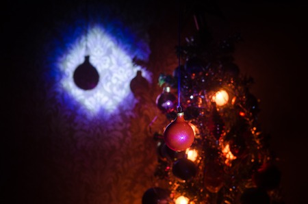 Christmas Toy on the Christmas tree. New Year ornaments winter background for postcard empty space....