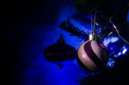 Christmas Toy on the Christmas tree. New Year ornaments winter background for postcard empty space. New Year eve background - glass Christmas toy. Greeting card. Selective focusの写真素材