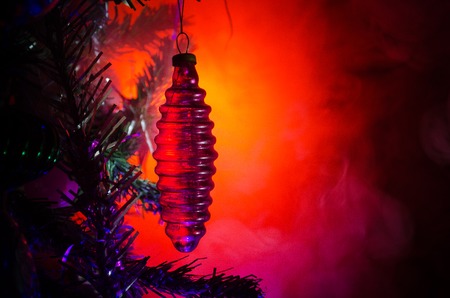 Christmas Toy on the Christmas tree. New Year ornaments winter background for postcard empty space. New Year eve background - glass Christmas toy. Greeting card. Selective focusの写真素材