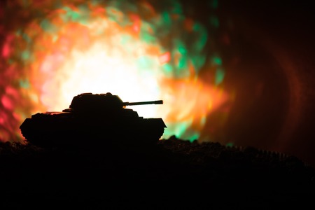 War Concept. Military silhouettes fighting scene on war fog sky background, World War German Tanks Silhouettes Below Cloudy Skyline At night. Attack scene. Armored vehicles. Tanks battleの写真素材