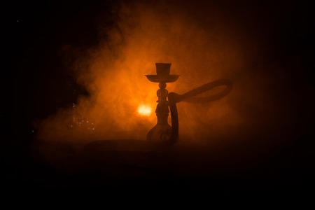 Hookah hot coals on shisha bowl with black background. Stylish oriental shisha. Shisha Concept. Selective focusの写真素材