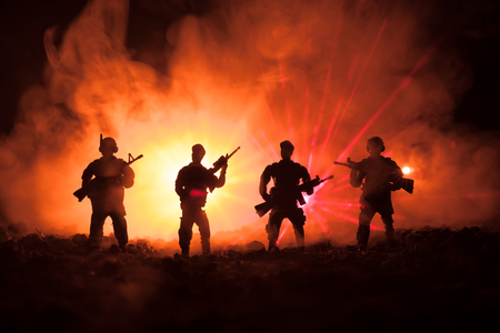 Anti-riot police give signal to be ready. Government power concept. Police in action. Smoke on a dark background with lights. Blue red flashing sirens. Dictatorship power. Selective focusの写真素材