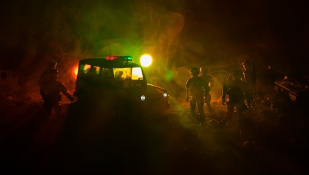 War Concept. Military silhouettes fighting scene on war fog sky background, World War Soldiers Silhouettes Below Cloudy Skyline At night. Attack scene. Armored vehicles. Tanks battle. Decorationの写真素材