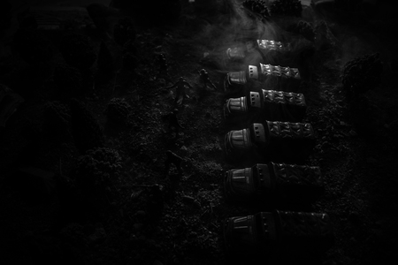 War Concept. Military silhouettes fighting scene on war fog sky background, World War Soldiers Silhouettes Below Cloudy Skyline At night. Attack scene. Armored vehicles. Selective focus. Decorationの写真素材