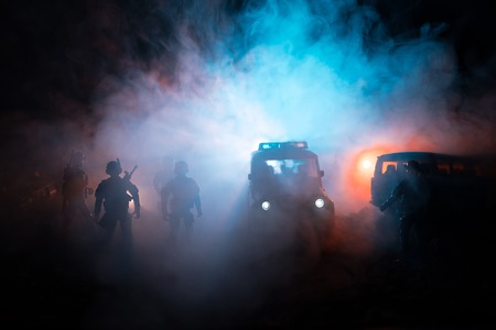 War Concept. Military silhouettes fighting scene on war fog sky background, World War Soldiers Silhouettes Below Cloudy Skyline At night. Attack scene. Armored vehicles. Tanks battle. Decorationの写真素材